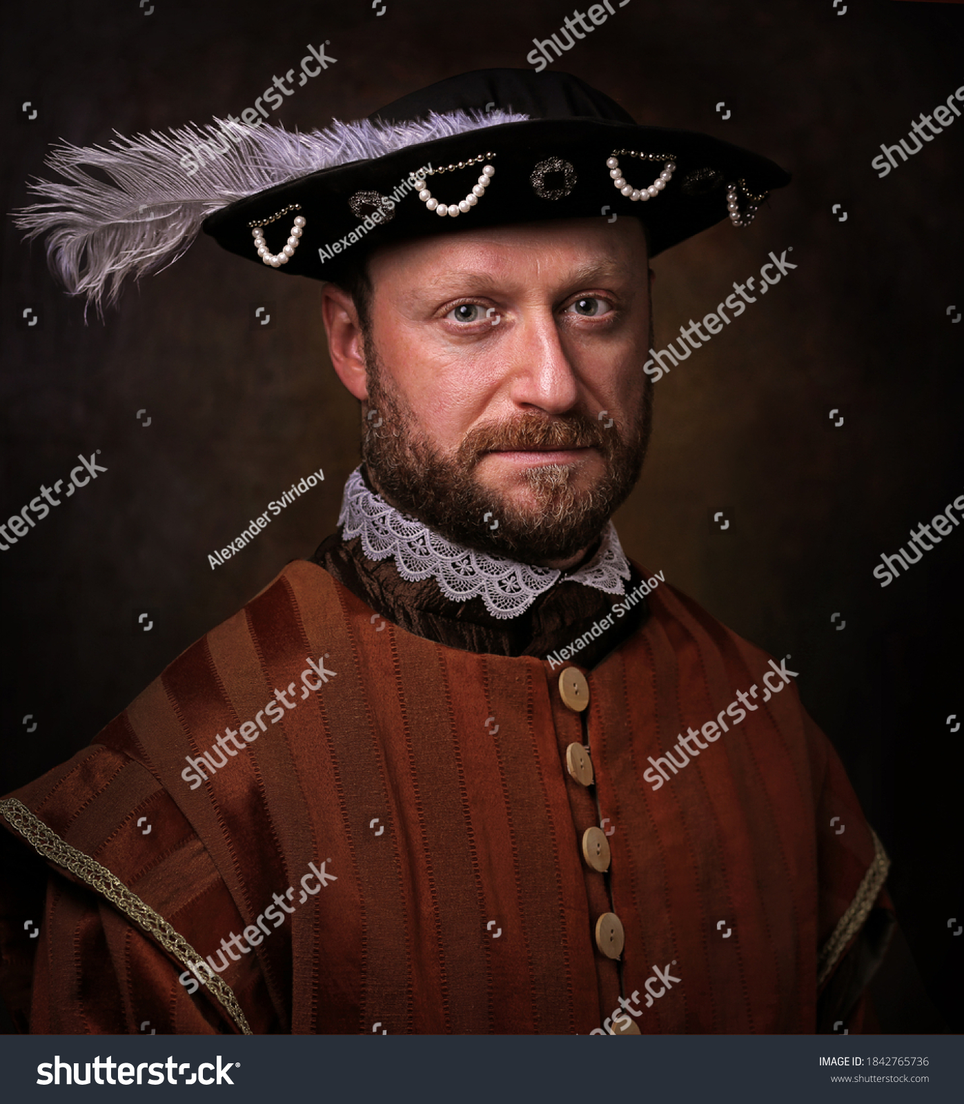 Portrait of medieval man in vintage clothing on dark background. #1842765736