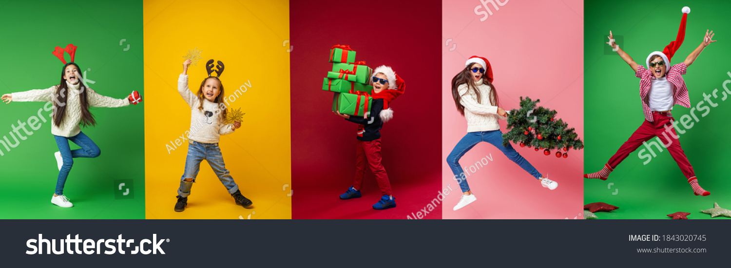 Merry Christmas! Happy children in full growth in a Santa hat, reindeer horns with gifts, Christmas tree and stars on a multi-color background, collage. Green, yellow, red, pink backgrounds #1843020745