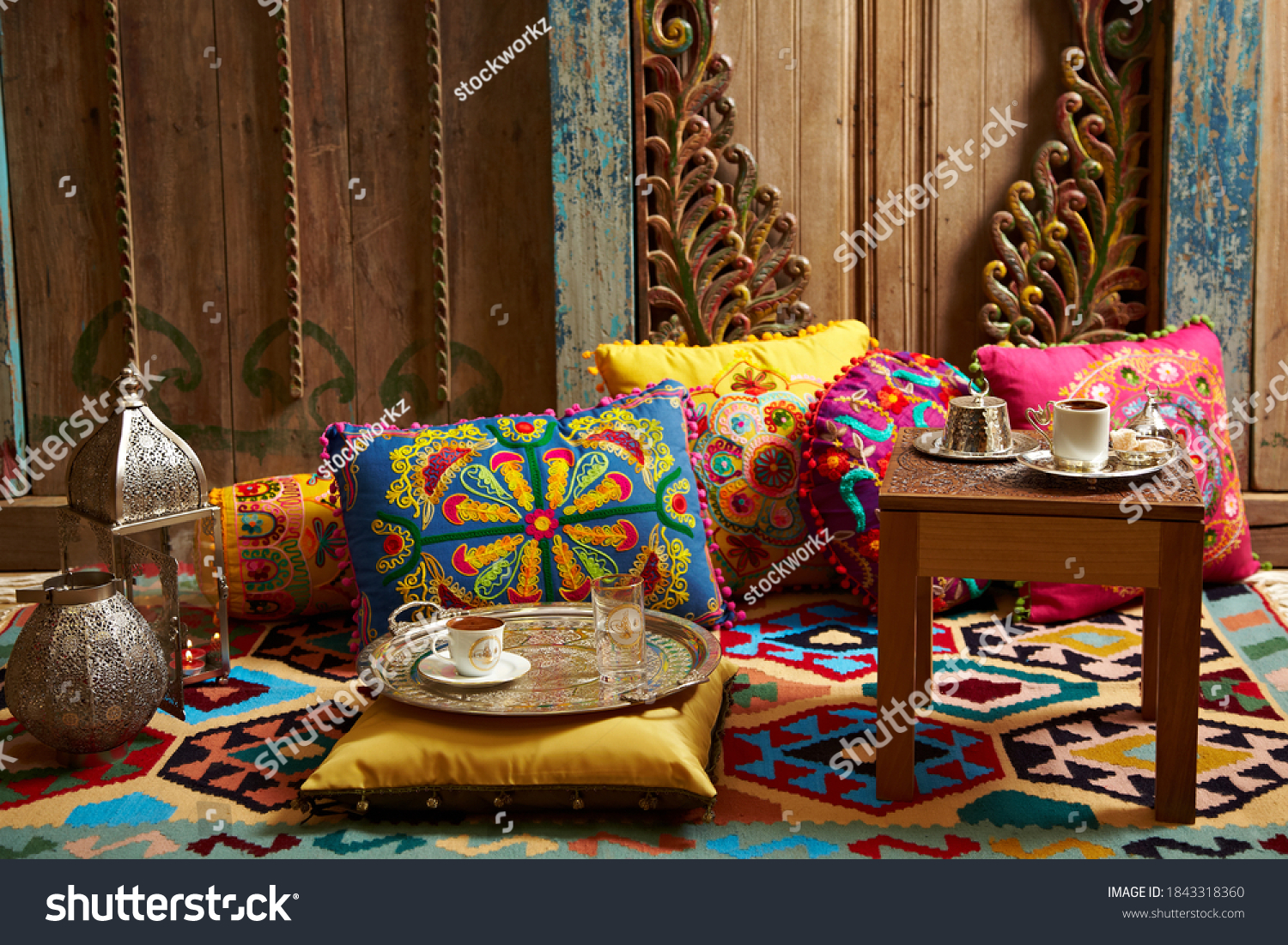 carved wood design pillows embroidered with fluorescent colors in front of the wall oriental corner turkish coffee presentation #1843318360