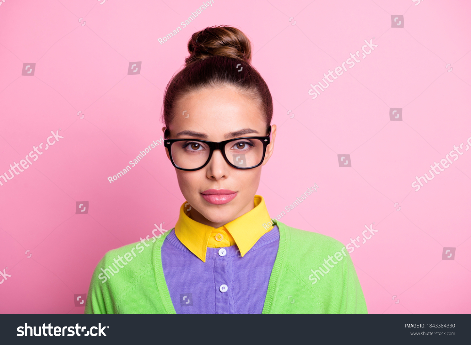 Closeup portrait photo of gorgeous lovely serious calm student girl knot hairstyle confident calm serious look camera lipstick wear glasses colored clothes bright pink color background #1843384330