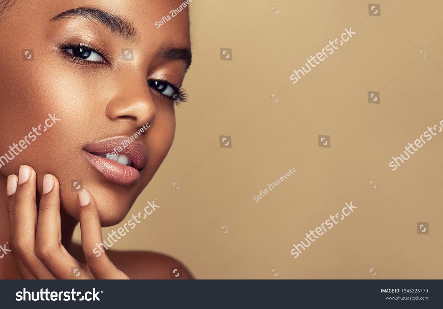 Beauty portrait of African American girl . Beautiful black woman touch her face . Facial  treatment . Cosmetology , skin care  and spa .  #1845326779