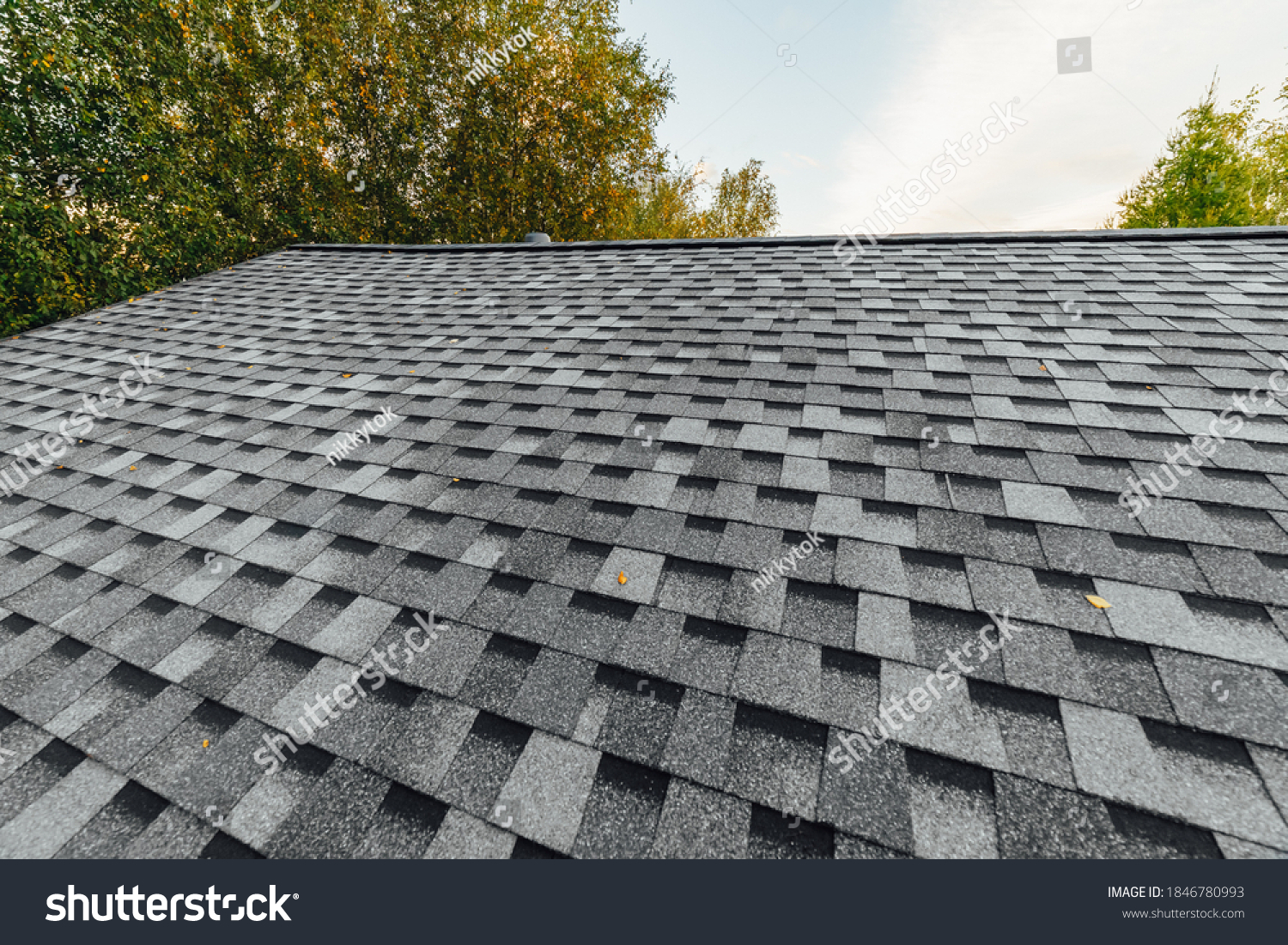 new renovated roof covered with shingles flat polymeric roof-tiles #1846780993