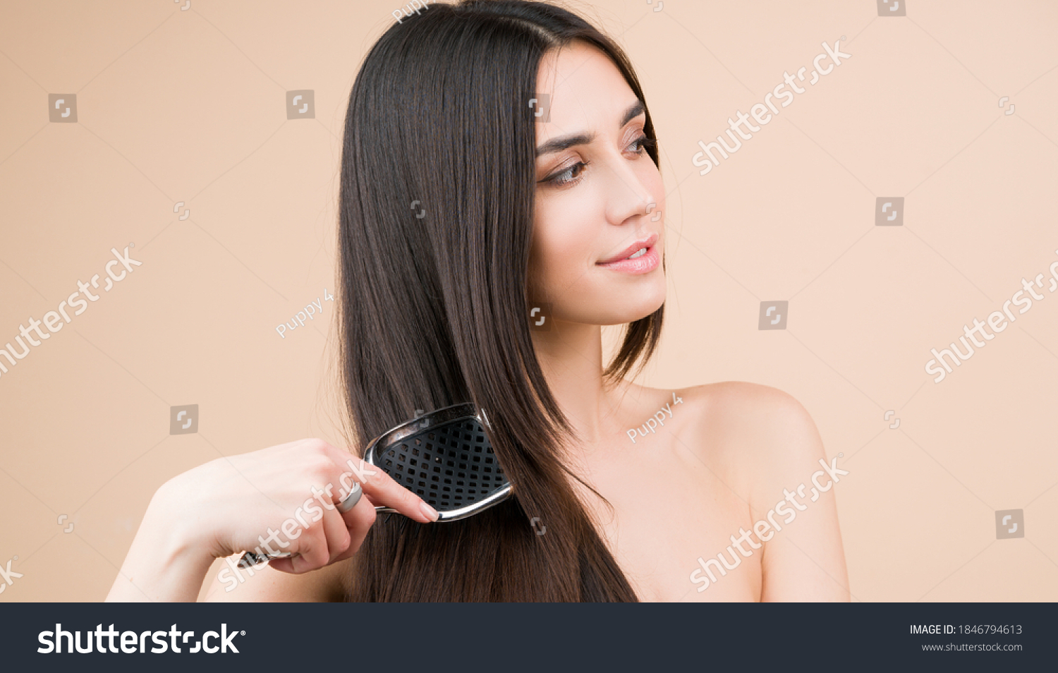 Brunette straight hair. Perfect woman with with a comb? Beautiful woman with long and shiny hair. Care. Female model after hair procedure. Natural health glance hair on beige background #1846794613