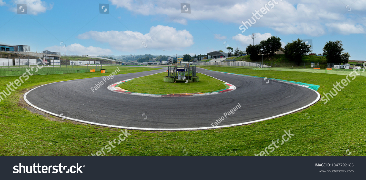 Hairpin bend turn in motorsport asphalt circuit scenic wide panoramic view #1847792185