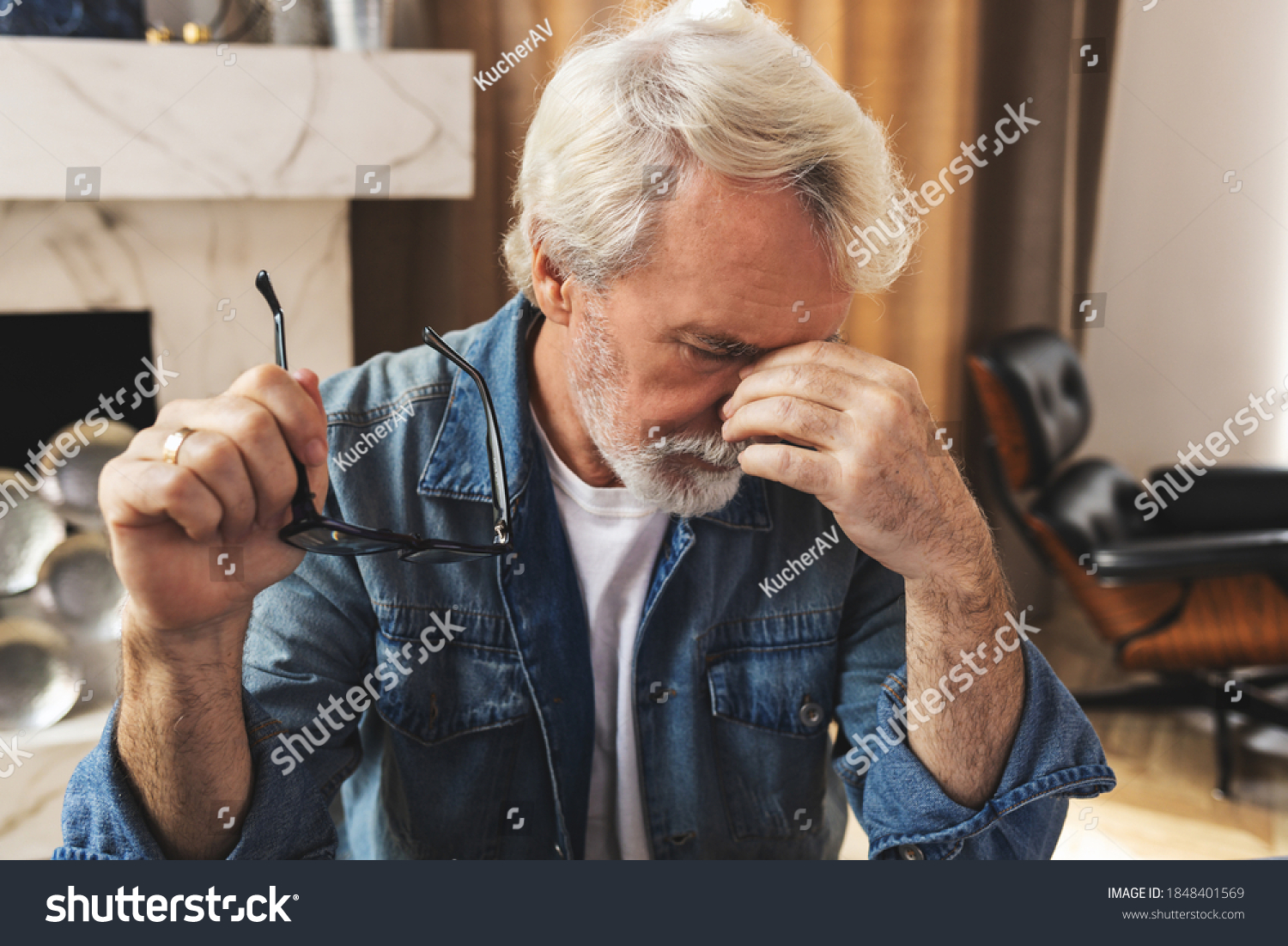 Tired men feel pain, eye strain holds glasses, rubbing dry irritated eyes, fatigue from working at a computer, stressed man suffers from headaches, poor eyesight, vision problems #1848401569
