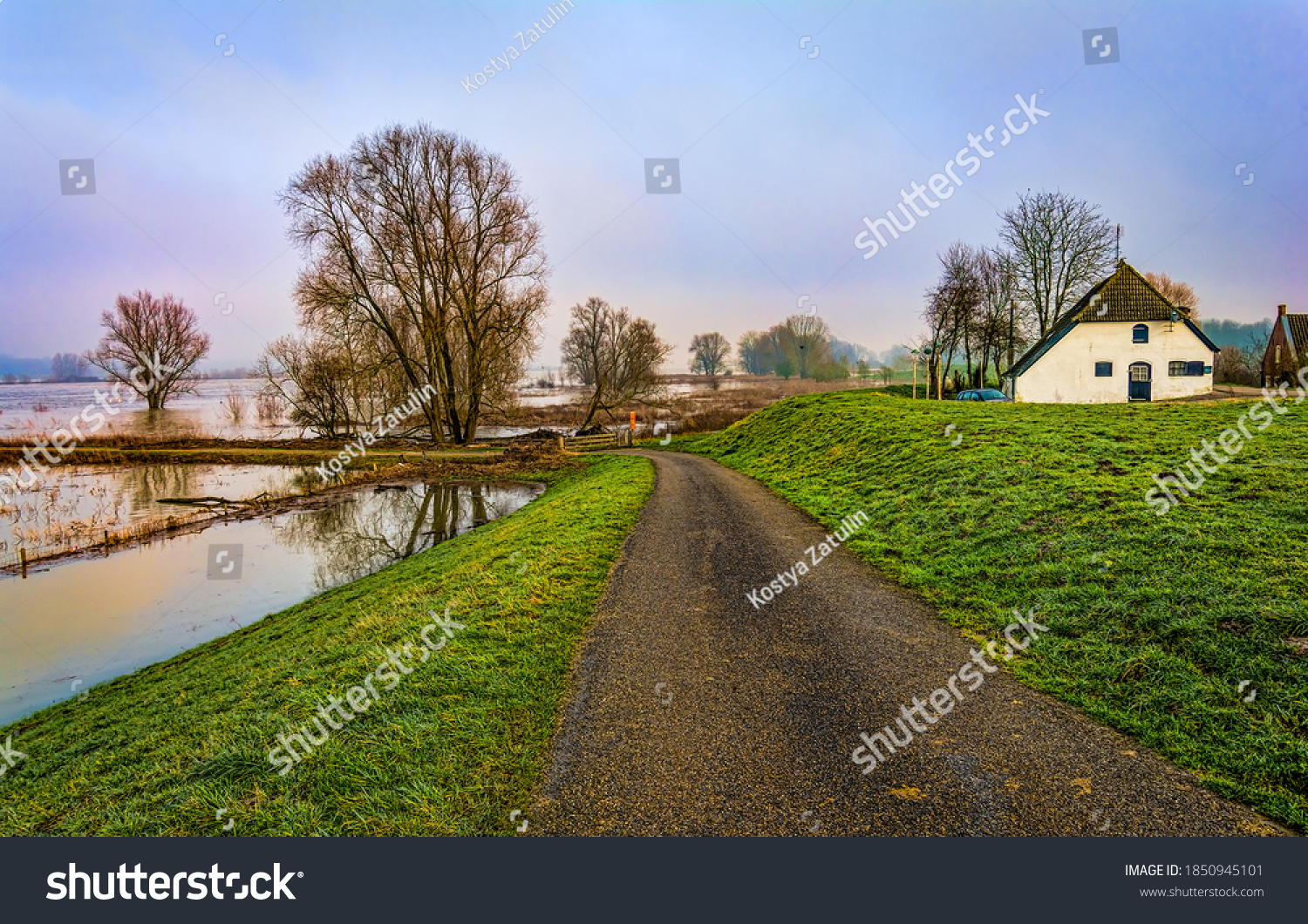 Rural country village road view. Country road in rural village #1850945101