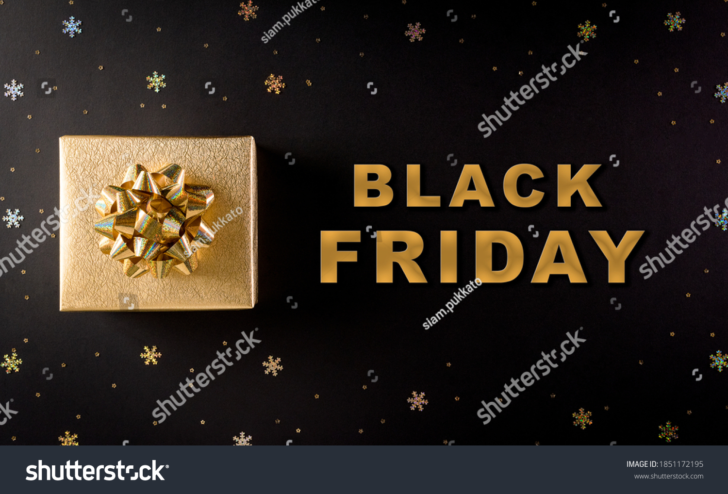 Top view of golden christmas gift boxes on black background with Black Friday text. Black Friday Sale, Banner, poster composition. #1851172195