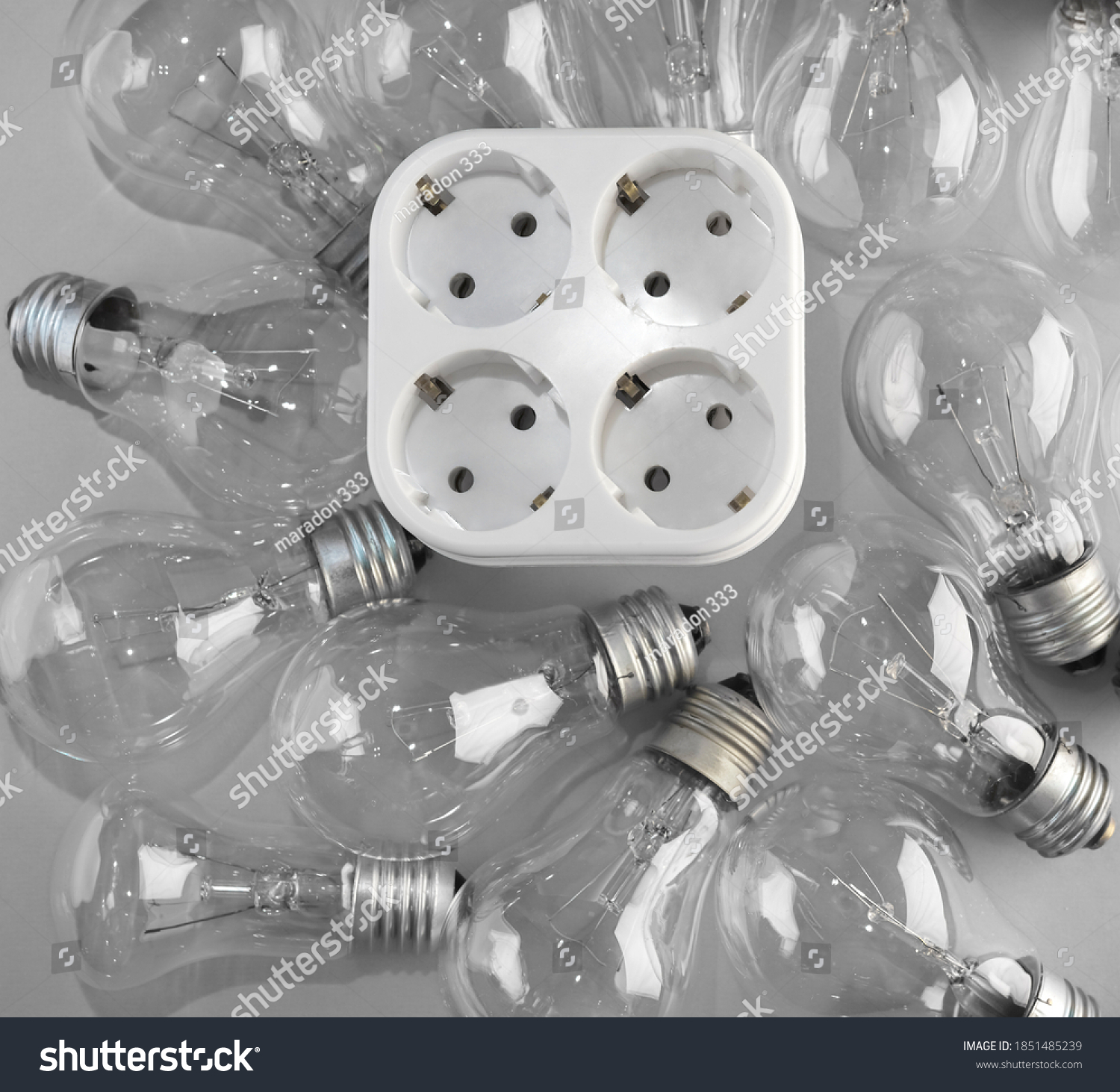 socket quadruple lie inside many lamp bulb. #1851485239