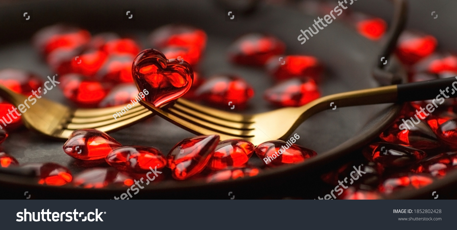 Banner. Festive table setting.Heart on a fork close-up. Holiday concept. Valentine's Day. Copy space for inscriptions. #1852802428