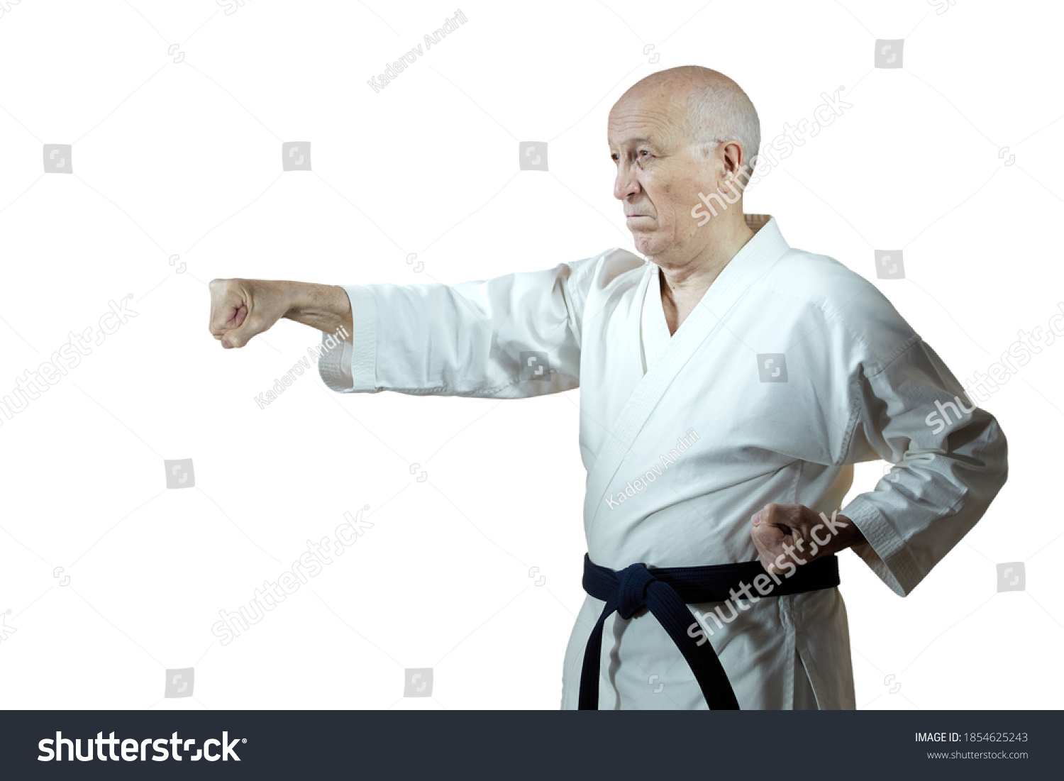 On white isolated background old man athlete in karategi beats hand punch #1854625243