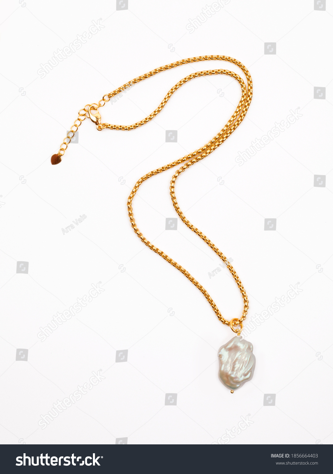 Luxury elegant golden chain with baroque pearl pendant isolated on white background. Close-up shot #1856664403
