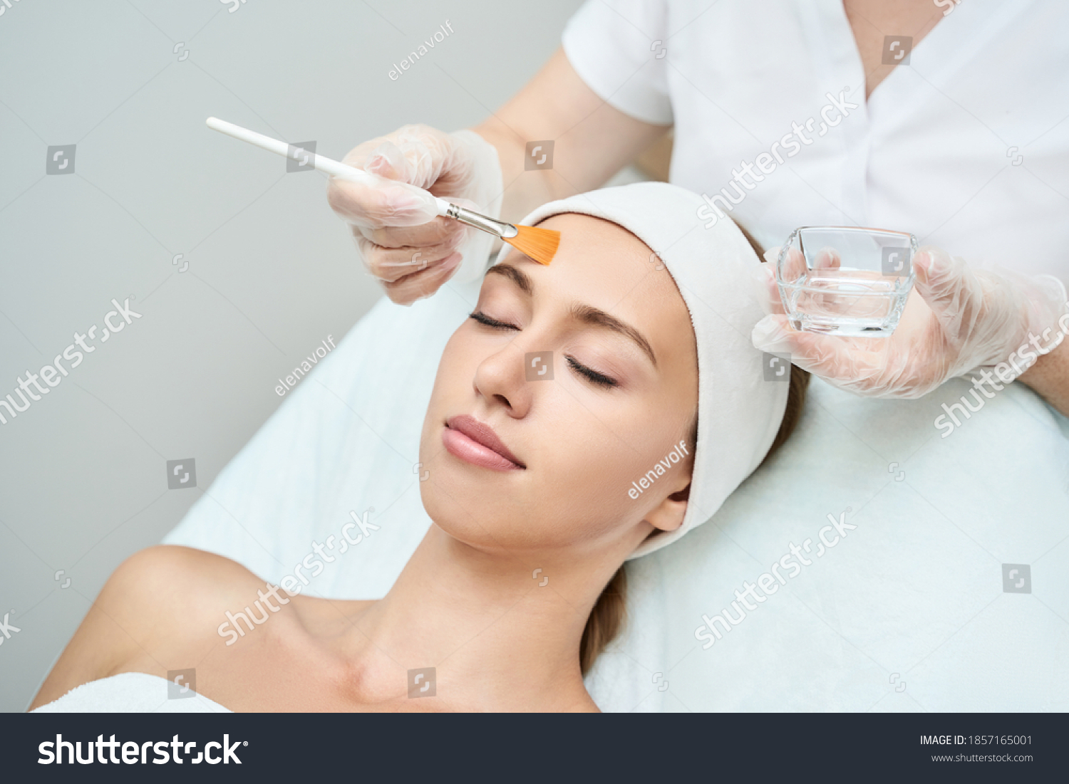 Cosmetology beauty procedure. Young woman skin care. Beautiful female person. Rejuvenation treatment. Facial chemical peel therapy. Clinical healthcare. Doctor hand. Dermatology cleanser. #1857165001