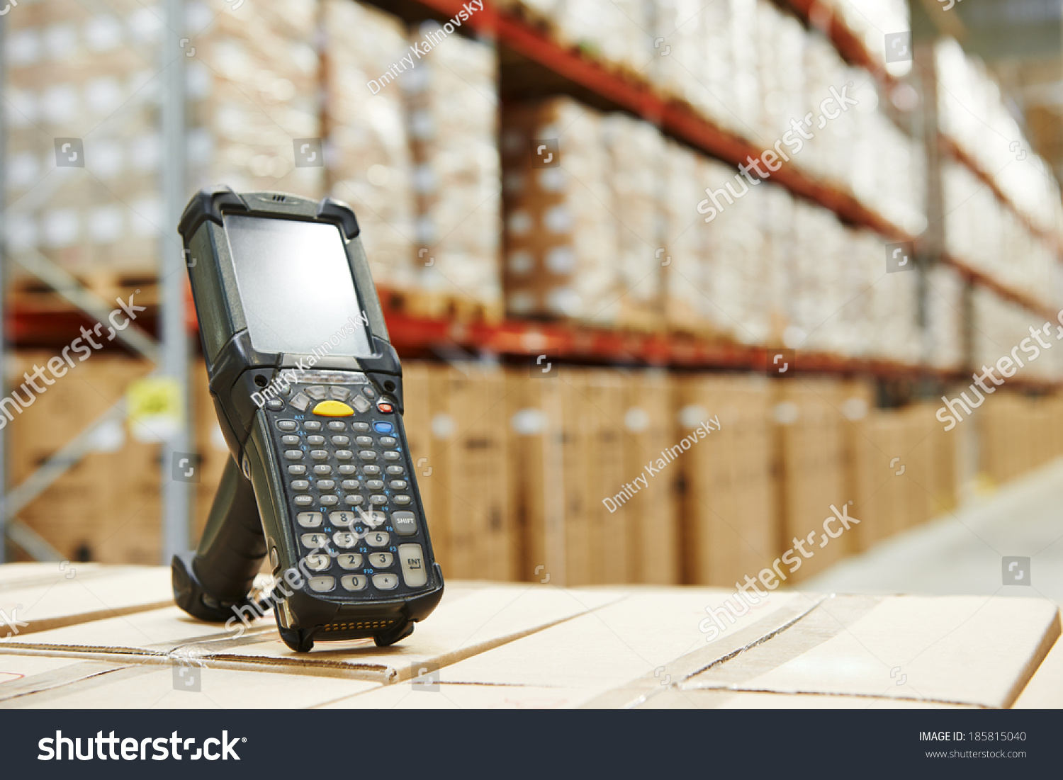 Bluetooth barcode scanner in front of modern warehouse #185815040
