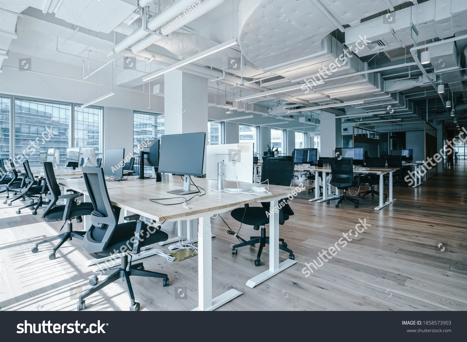 Interior of modern empty office building.Open white ceiling design with wooden floor. #1858573903
