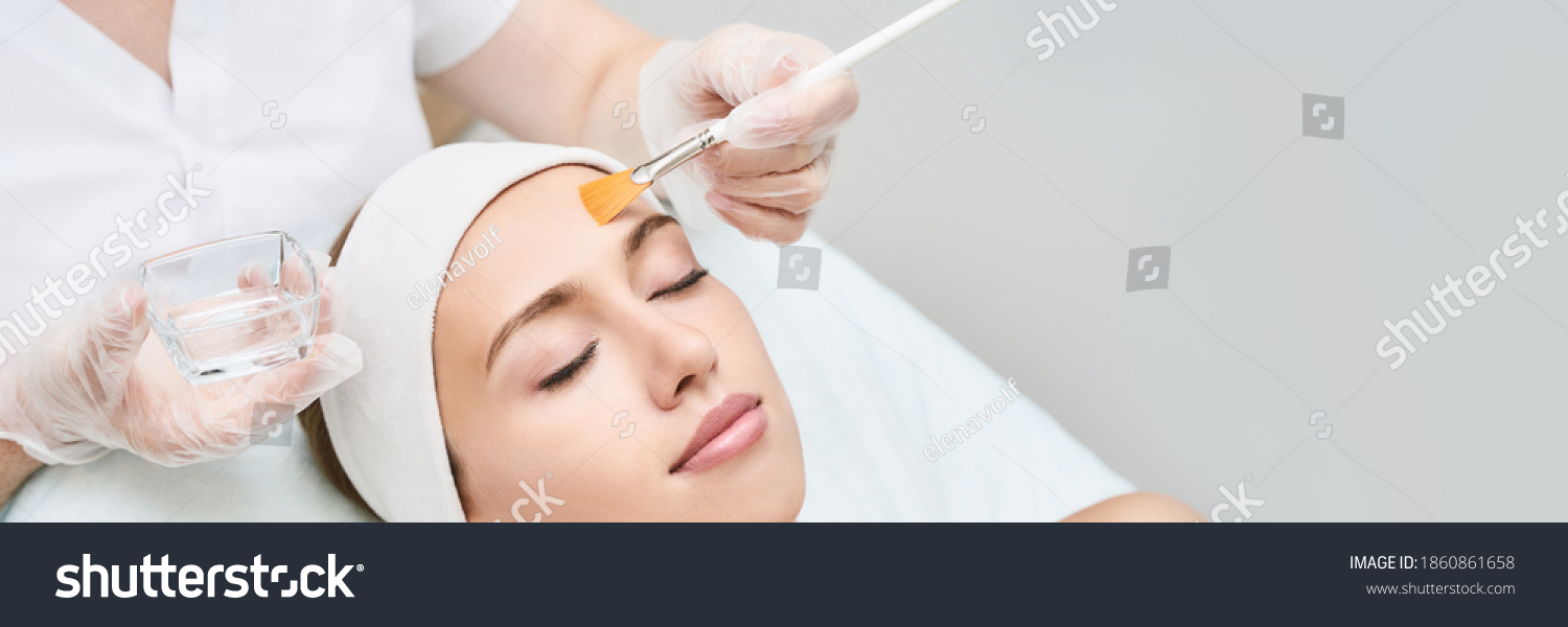 Cosmetology beauty procedure. Young woman skin care. Beautiful female person. Rejuvenation treatment. Facial chemical peel therapy. Clinical healthcare. Doctor hand. Dermatology cleanser. Copyspace #1860861658