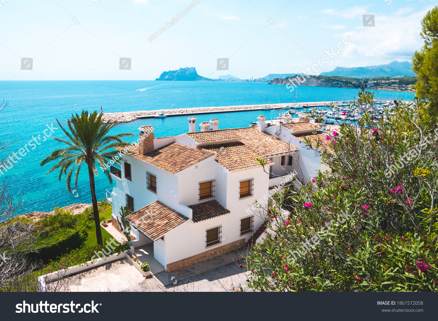 Traditional white houses with unspoiled idyllic view of marina, coastline and Mediterranean Sea in Moraira, Costa Blanca, Spain #1861572058