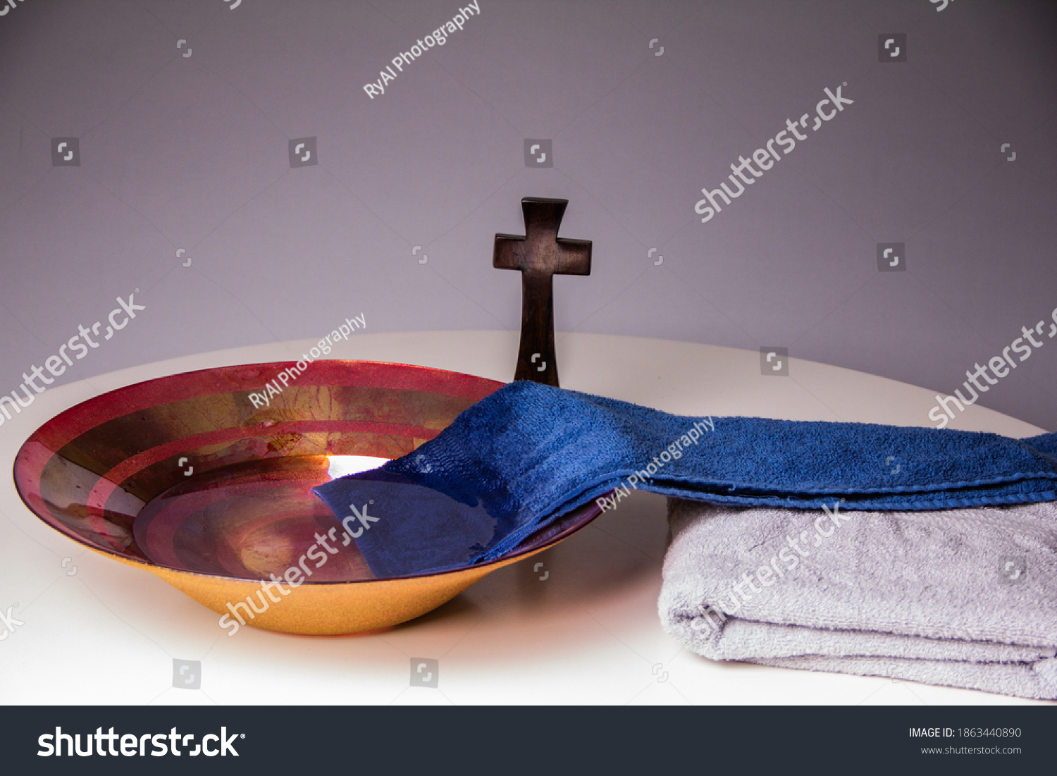 Towel in bowl of water on Maundy Thursday #1863440890