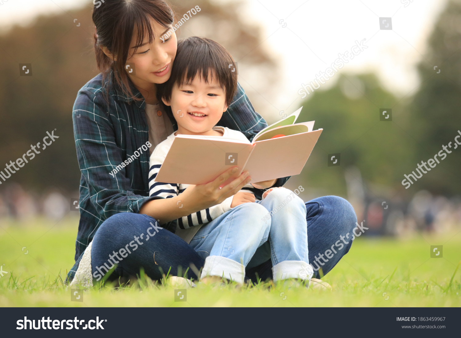 Parents and children reading books #1863459967