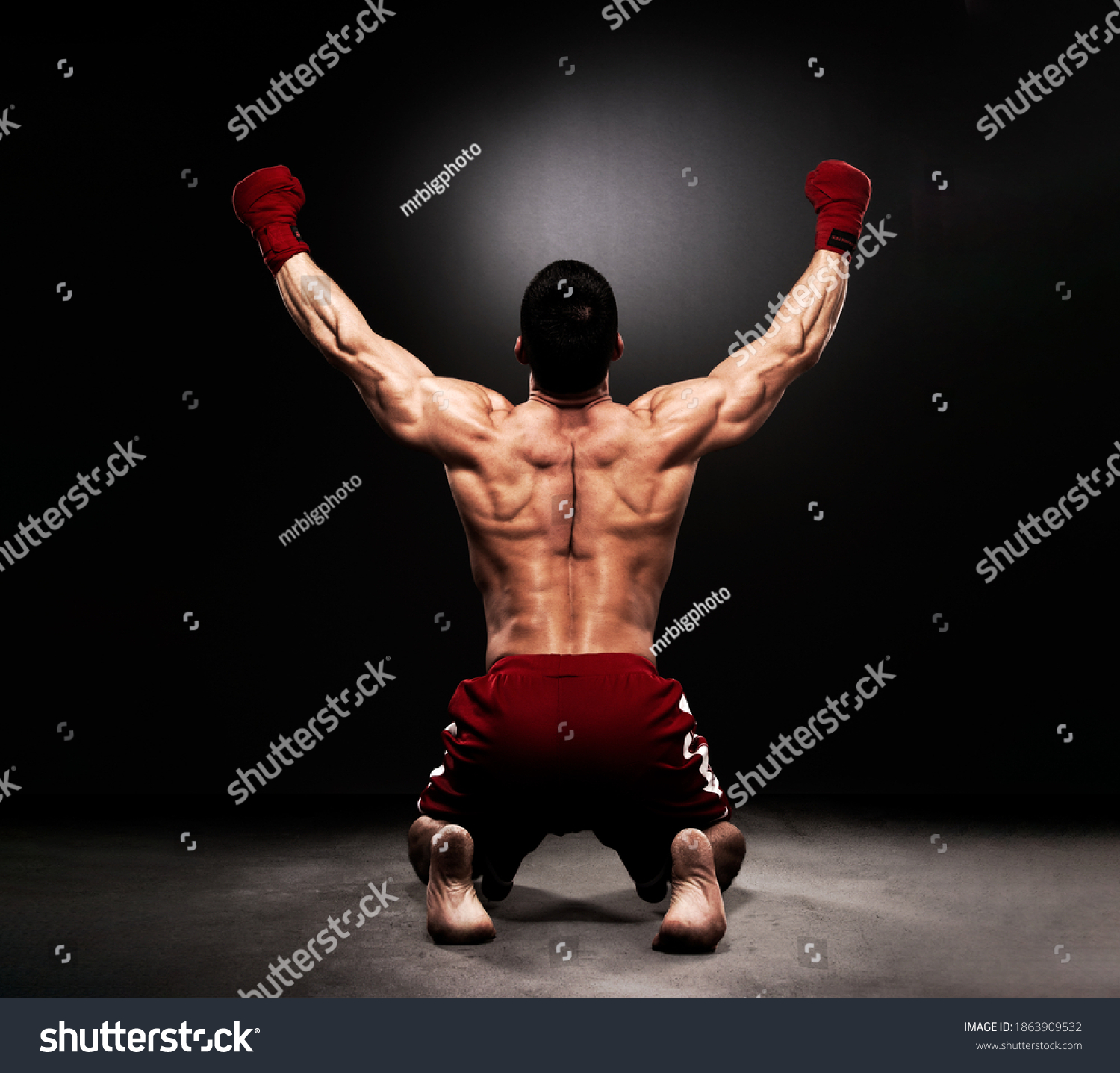MMA Fighter On the Floor Celebrating Victory #1863909532