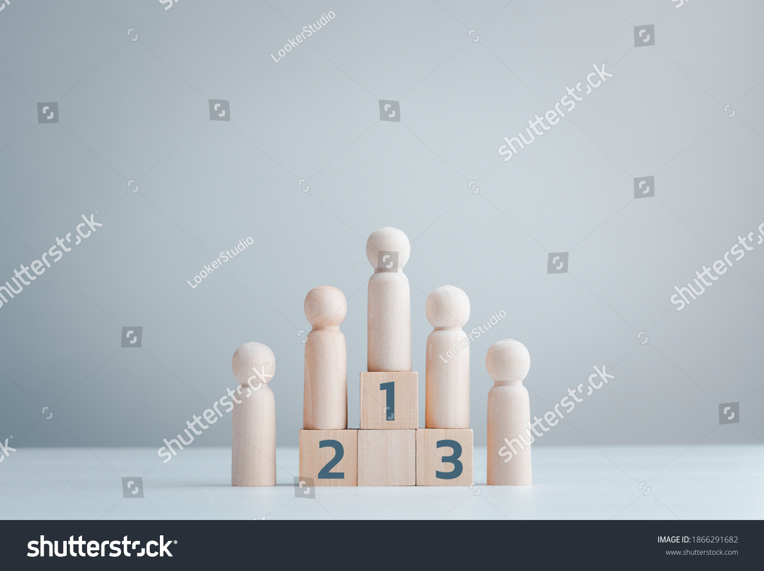 Business hierarchy, ranking and strategy concept with wood doll standing on a podium 1, 2, 3 of wooden building blocks with copy space. #1866291682
