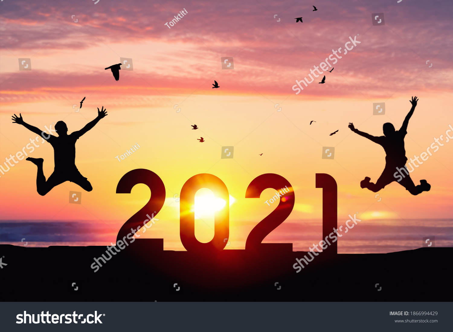 Silhouette men jumping and birds flying on sunset sky at top of mountain and number like 2021 abstract background. Happy new year and holiday celebration concept. Vintage tone filter color style. #1866994429
