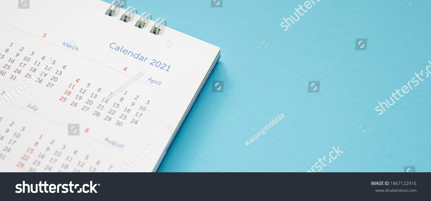 2021 calendar page on blue background business planning appointment meeting concept #1867122916