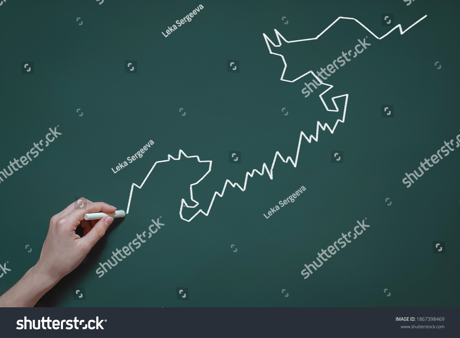 graph, diagram, chart of stock quotes drawn in chalk on a blackboard, the concept of trading, speculation, bulls and bears in the stock market, hand with chalk #1867398469