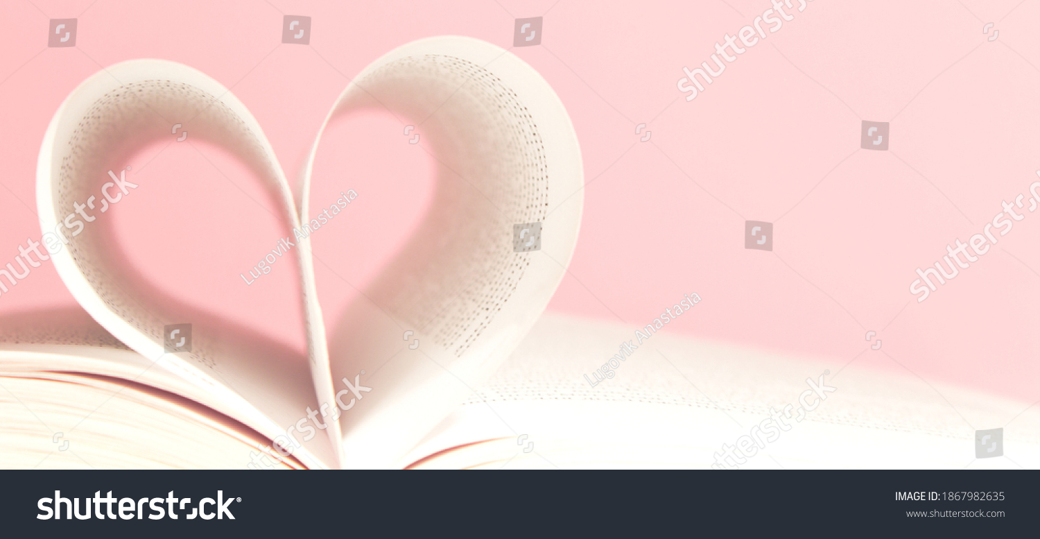Book pages in shape of heart on pink background. Love, valentines or mother's day concept. Close up, copy space. #1867982635