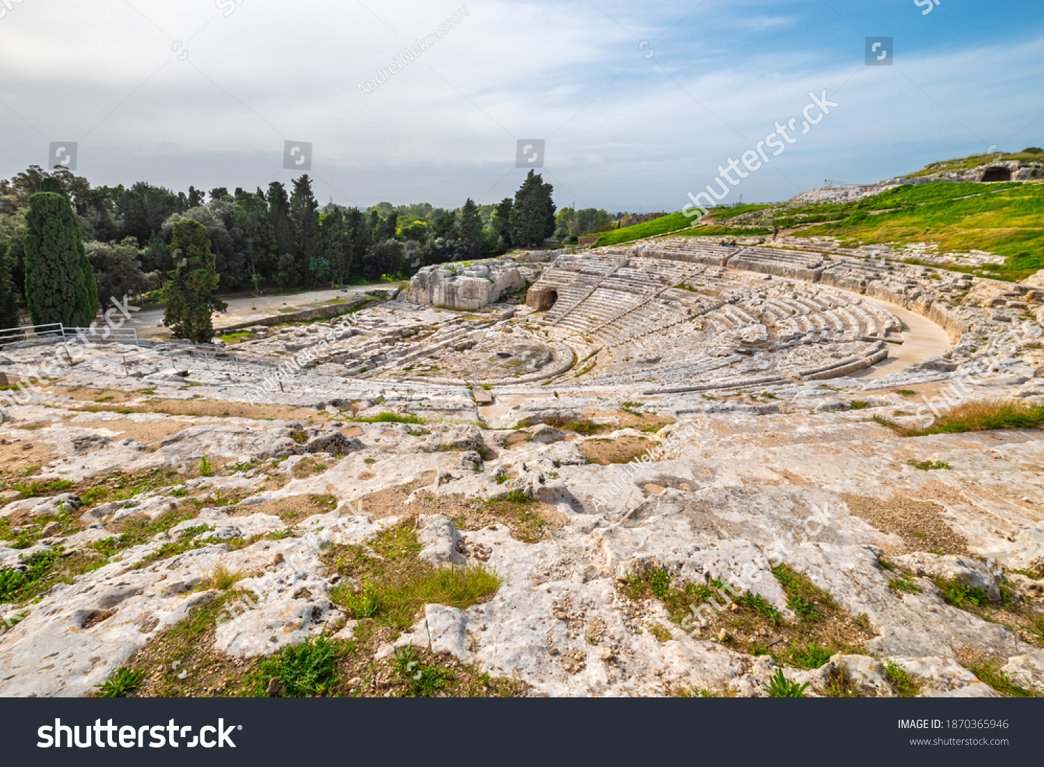 View to auditorium of the ancient Greek theatre (Teatro Greco) in Syracuse. Sicily, Italy #1870365946