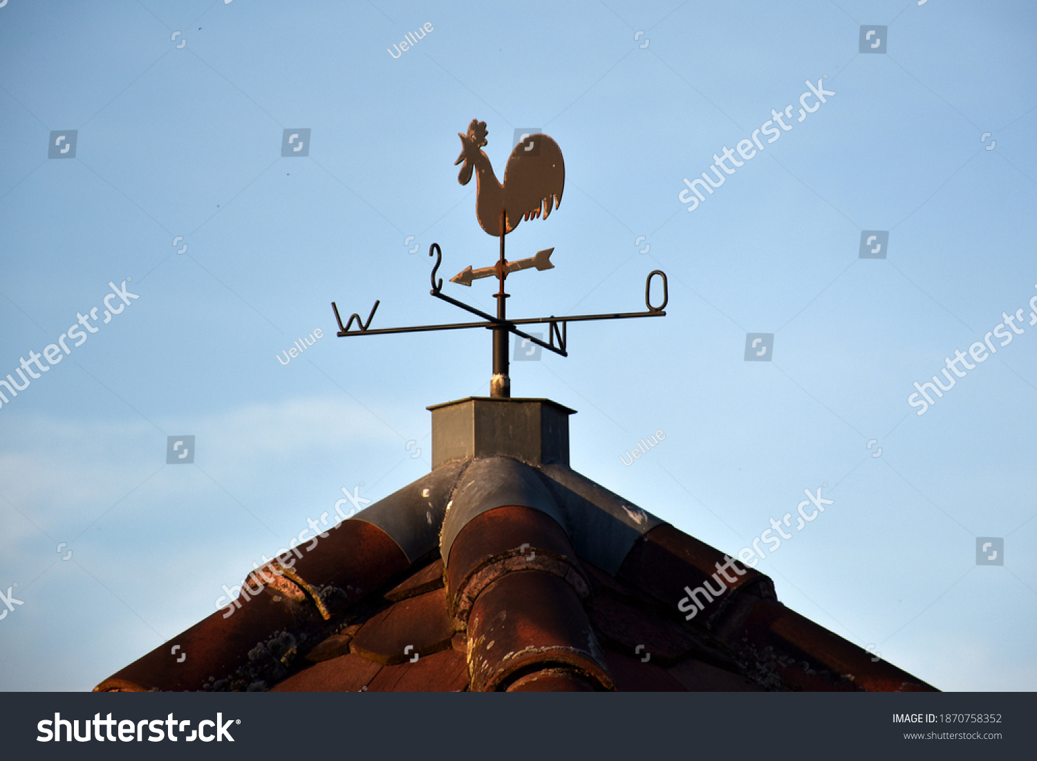 Weathercock on a house gable #1870758352
