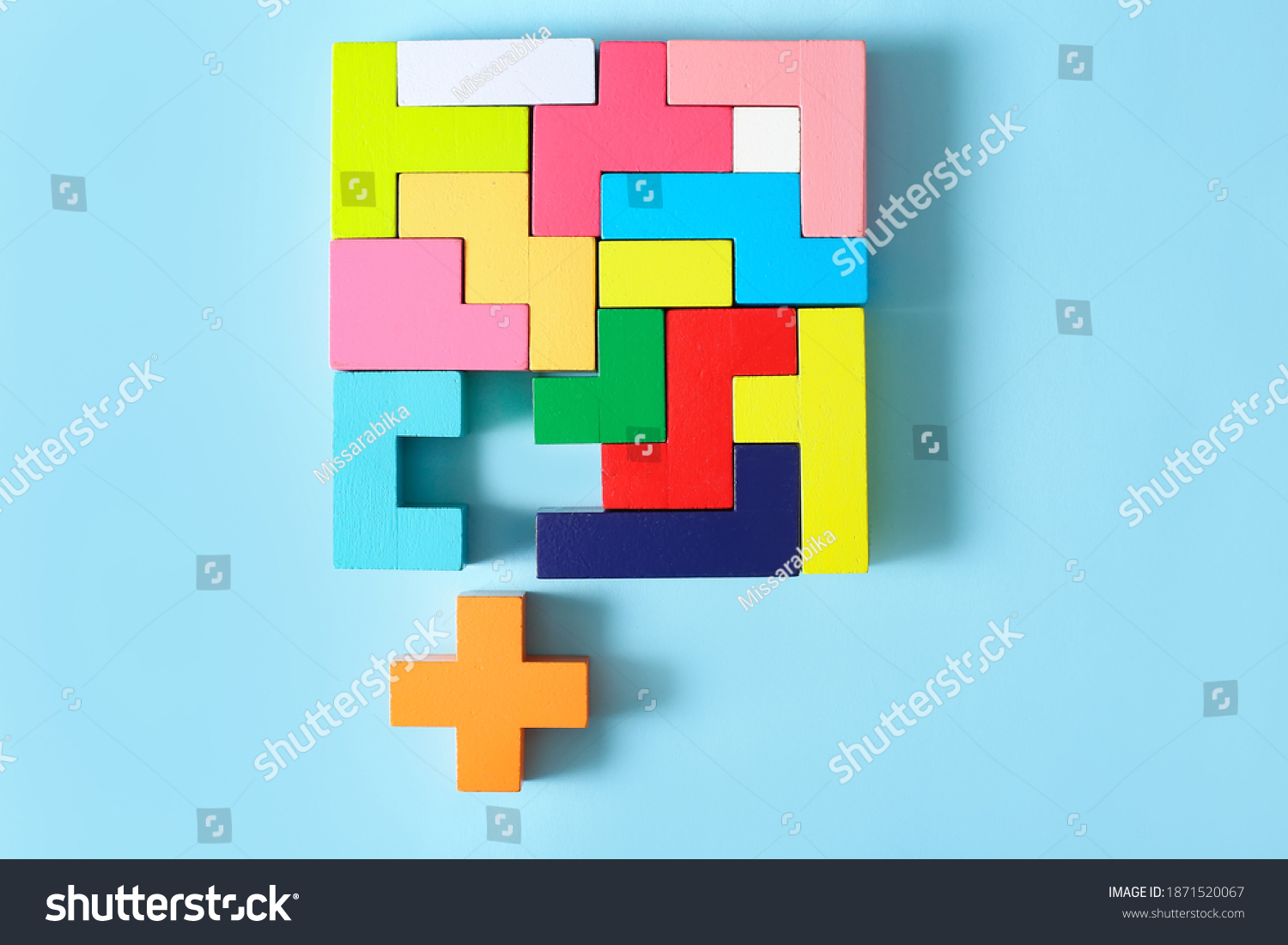 Concept of creative, logical thinking. Different colorful shapes wooden blocks on light background. Geometric shapes in different colors. Child development. Riddle and its solution. Logic tasks. #1871520067