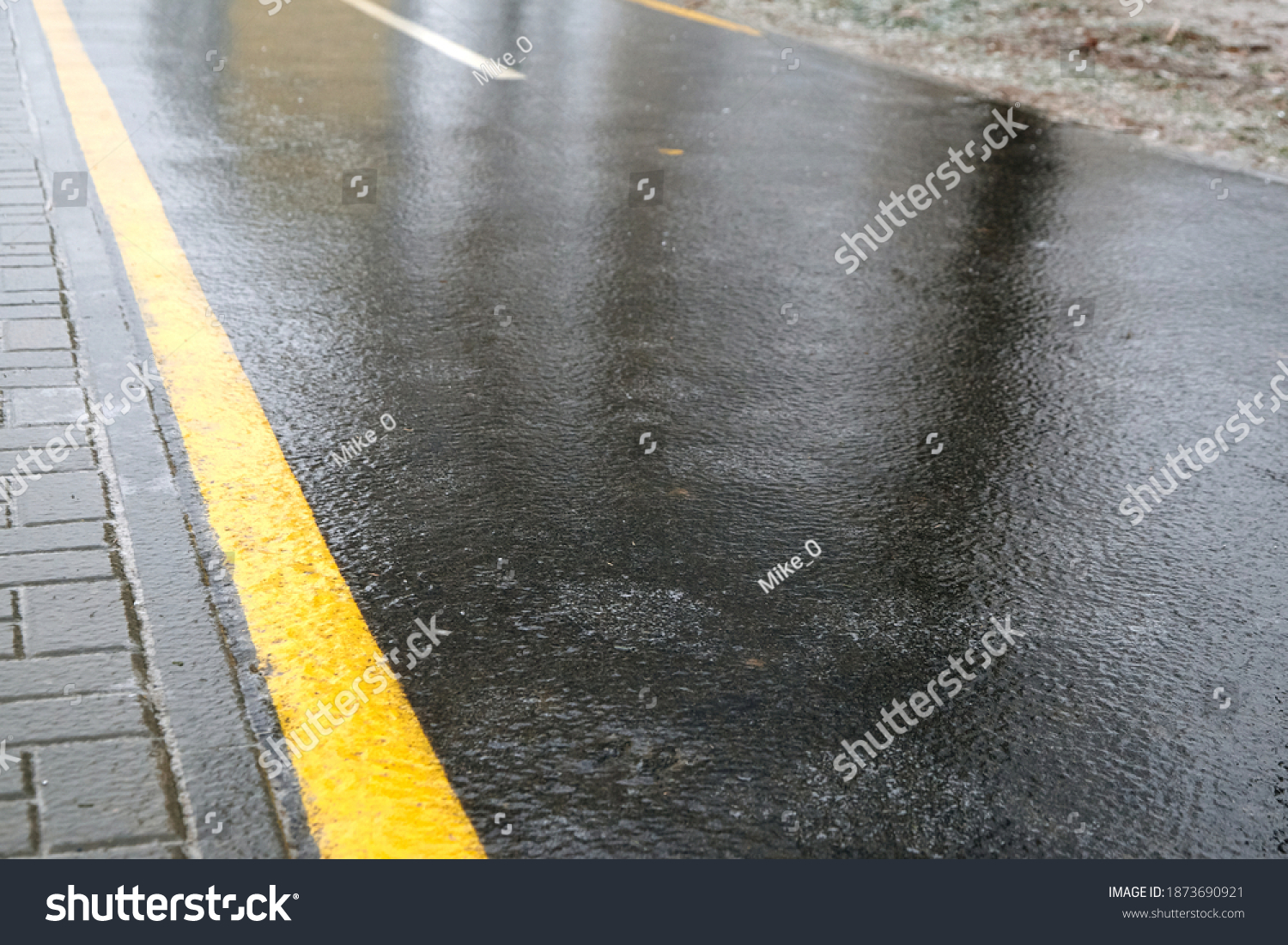 Ice crusted ground, icy road, slippery street, winter weather #1873690921
