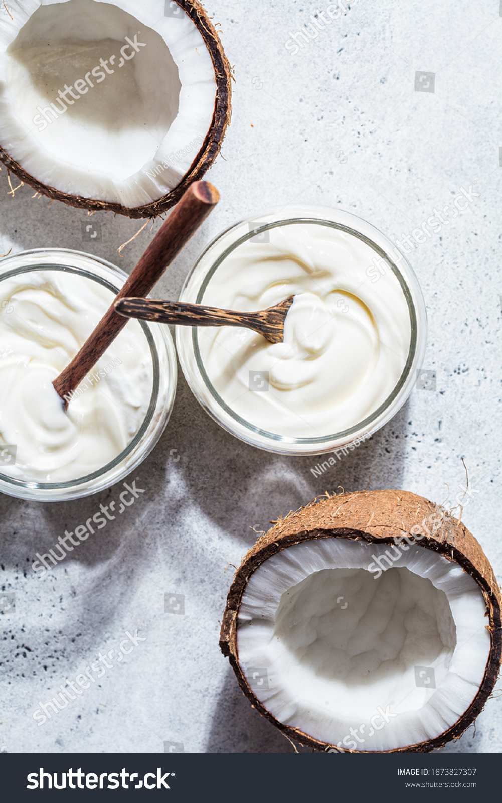 Vegan coconut yogurt in glass jars, white background. #1873827307