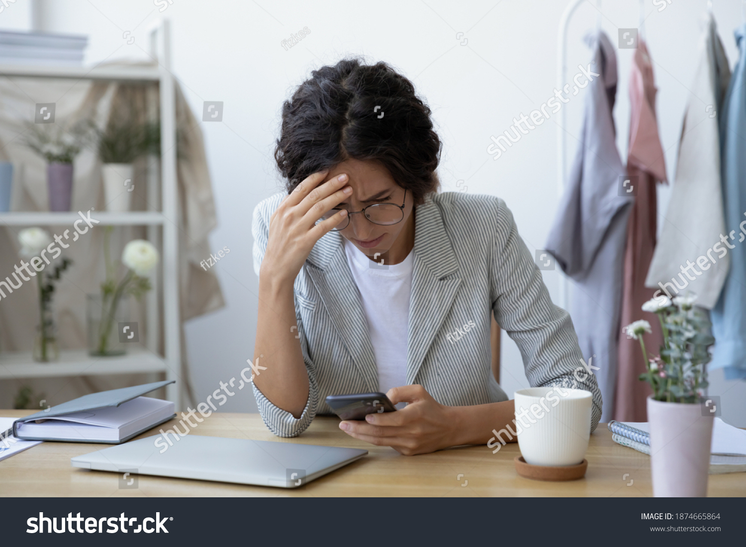 Unexpected problems. Concerned young woman self employed florist getting email with bad news about debt bankruptcy. Female tailor owner of make and mend service stressed after losing customer order #1874665864