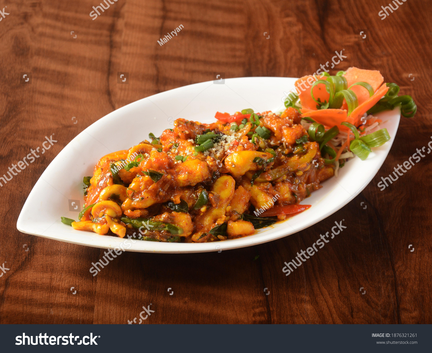 Paneer majestic, is a famous indian dish, served over a rustic wooden background, selective focus #1876321261
