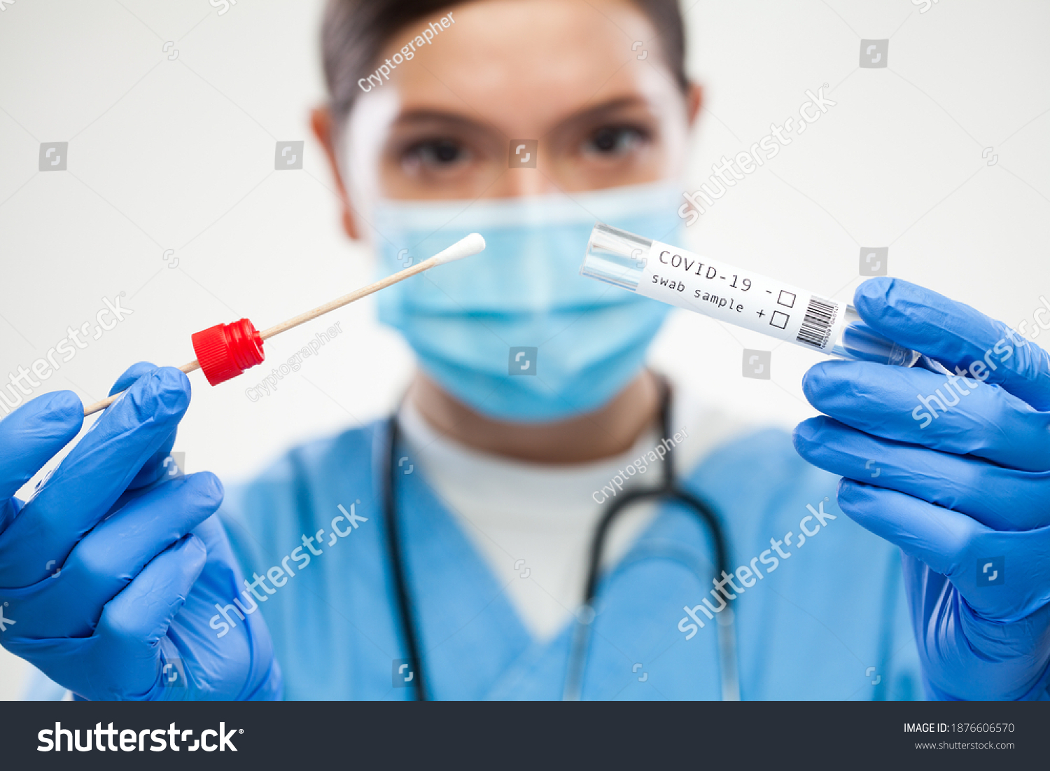 Female UK GP physician wearing personal protective equipment performing Coronavirus COVID-19 rt-PCR test,patient nasal NP oral OP swab sample specimen collection process,viral DNA diagnostic procedure #1876606570