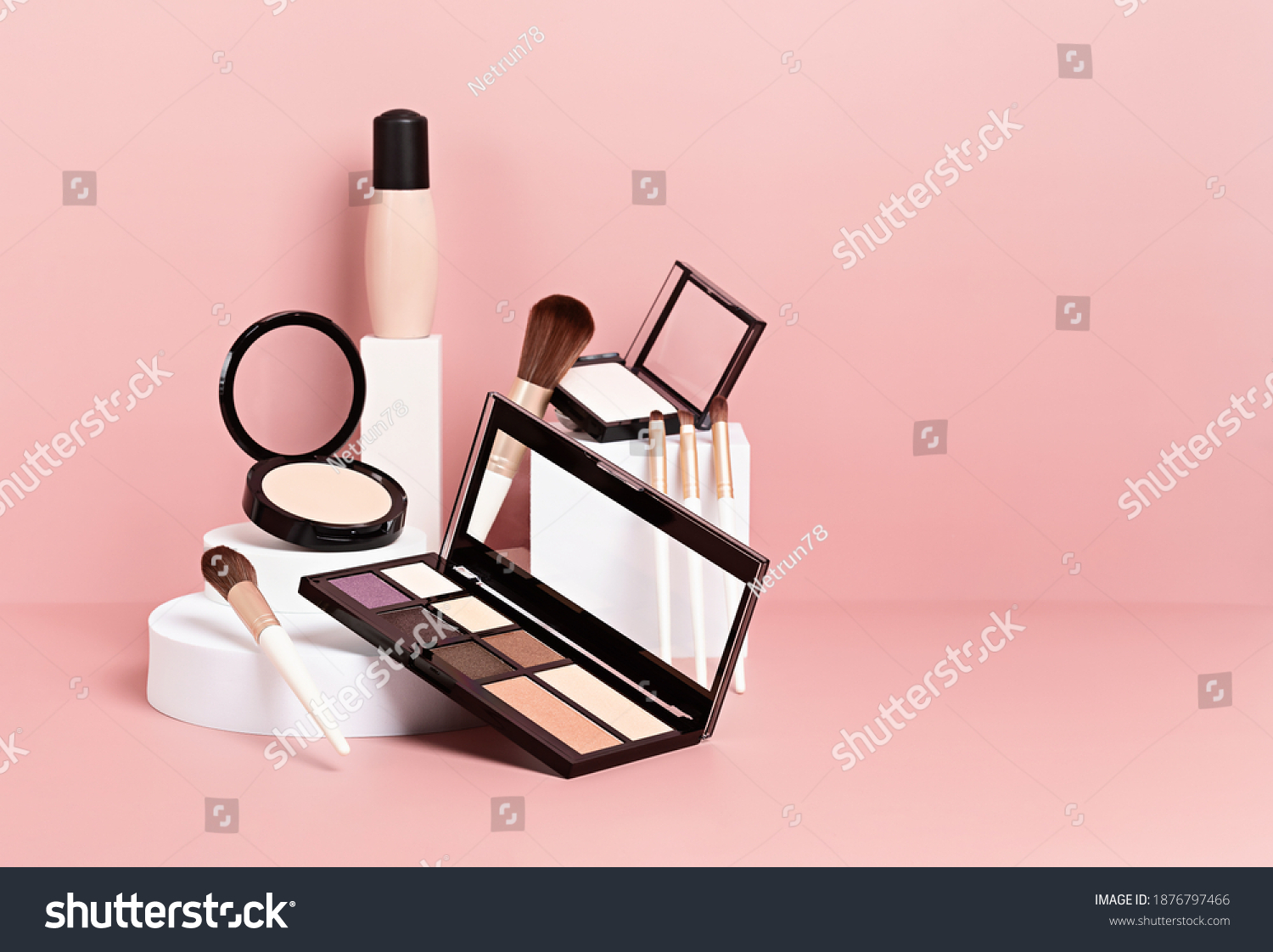 Make up products prsented on white podiums on pink pastel background. Mockup for branding and packaging presentation  #1876797466