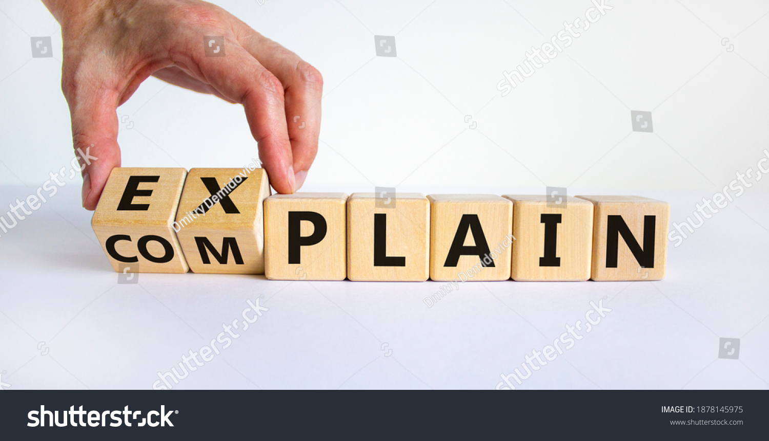 Explain vs complain symbol. Male hand flips wooden cubes and changes the word 'complain' to 'explain'. Beautiful white background, copy space. Business and explain vs complain concept. #1878145975