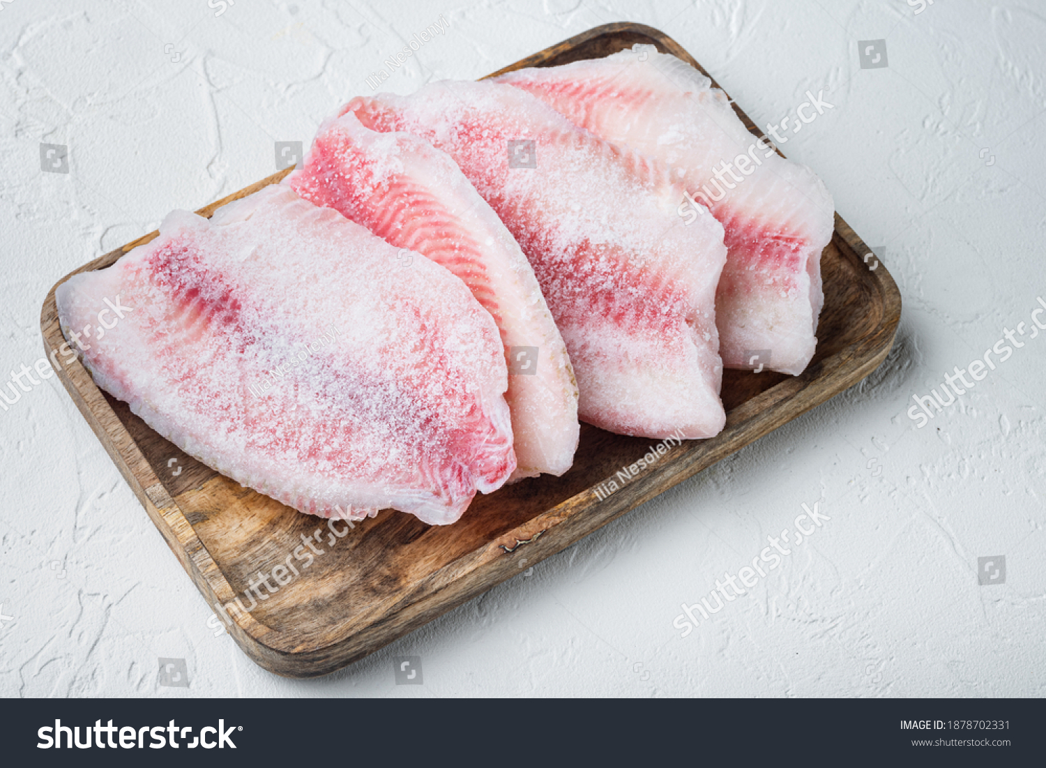 Frozen fish fillet, on white background #1878702331