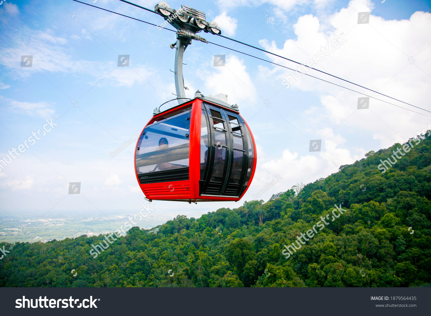 Cable car trip to viewpoints in the mountains. During the trip by cable car Tourists enjoy beautiful views and experience exciting. #1879564435