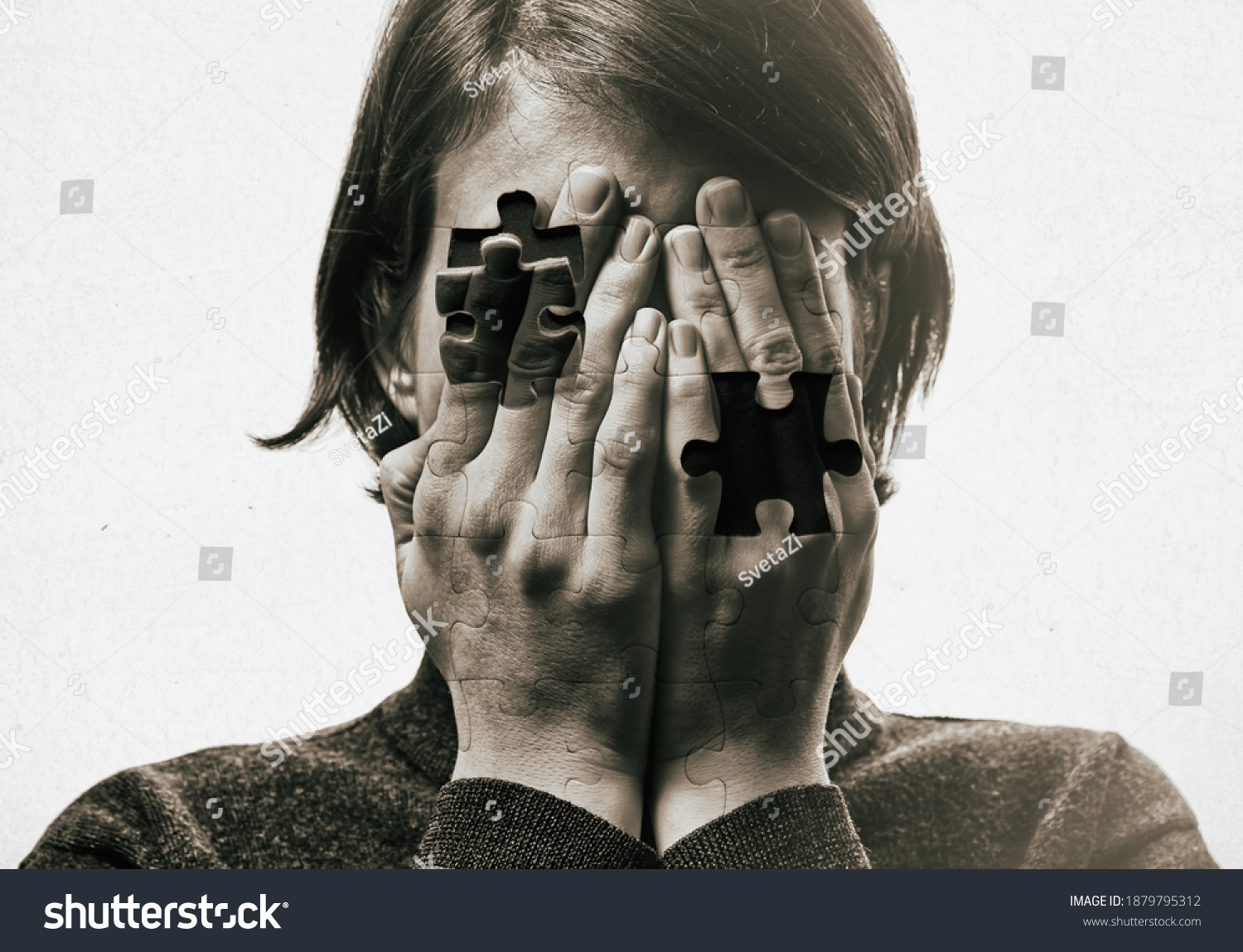 Self-destruction сoncept. Woman covers her face her hands on background with falling pieces of puzzle. Black and white image. #1879795312