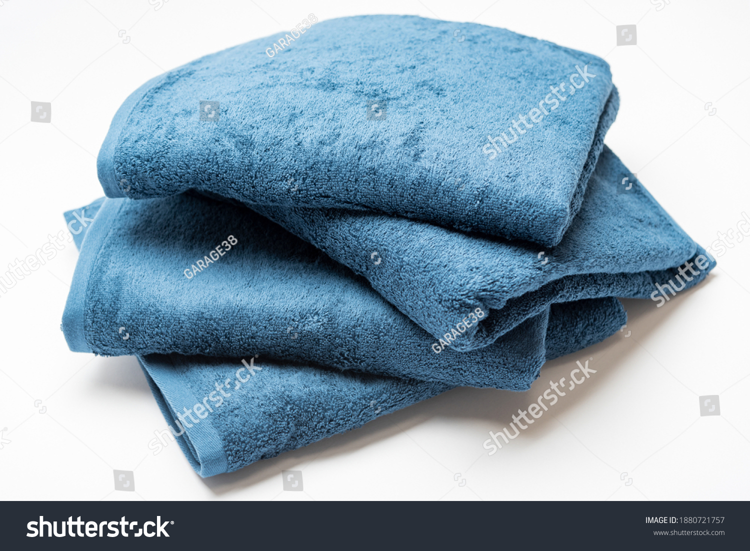 Blue bath towel taken on a white background #1880721757