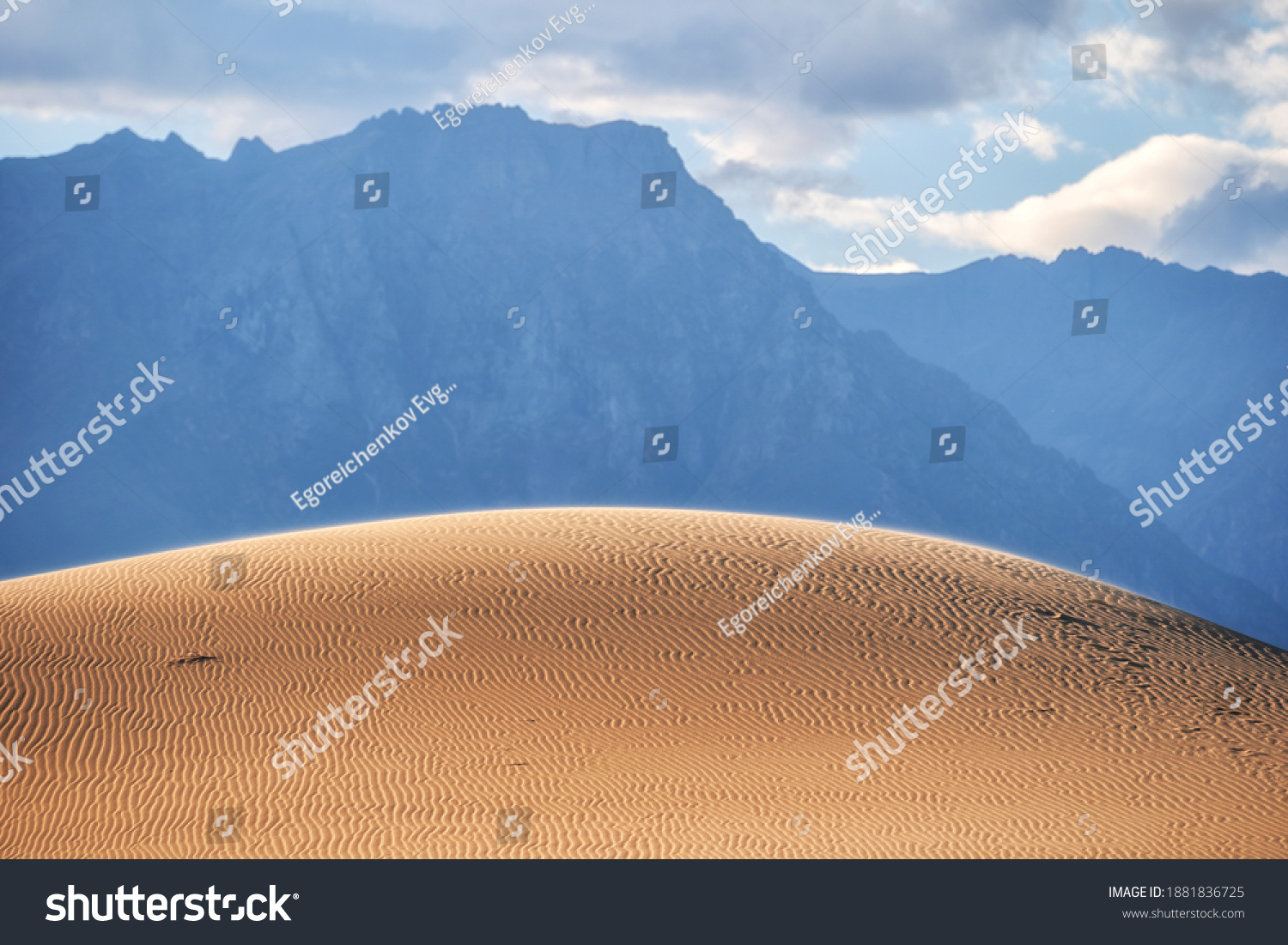 The hill of the Chara desert against the background of the Transbaikal mountains #1881836725