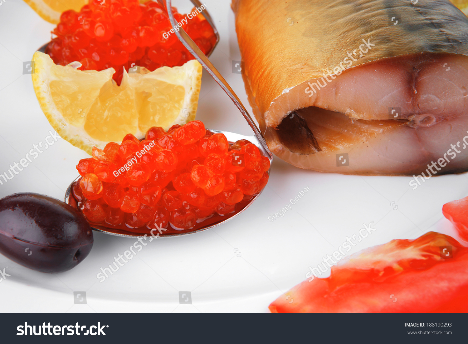 diet food - red caviar and smoked mackerel fish with lemon tomatoes and bread on white china plate isolated over white background #188190293