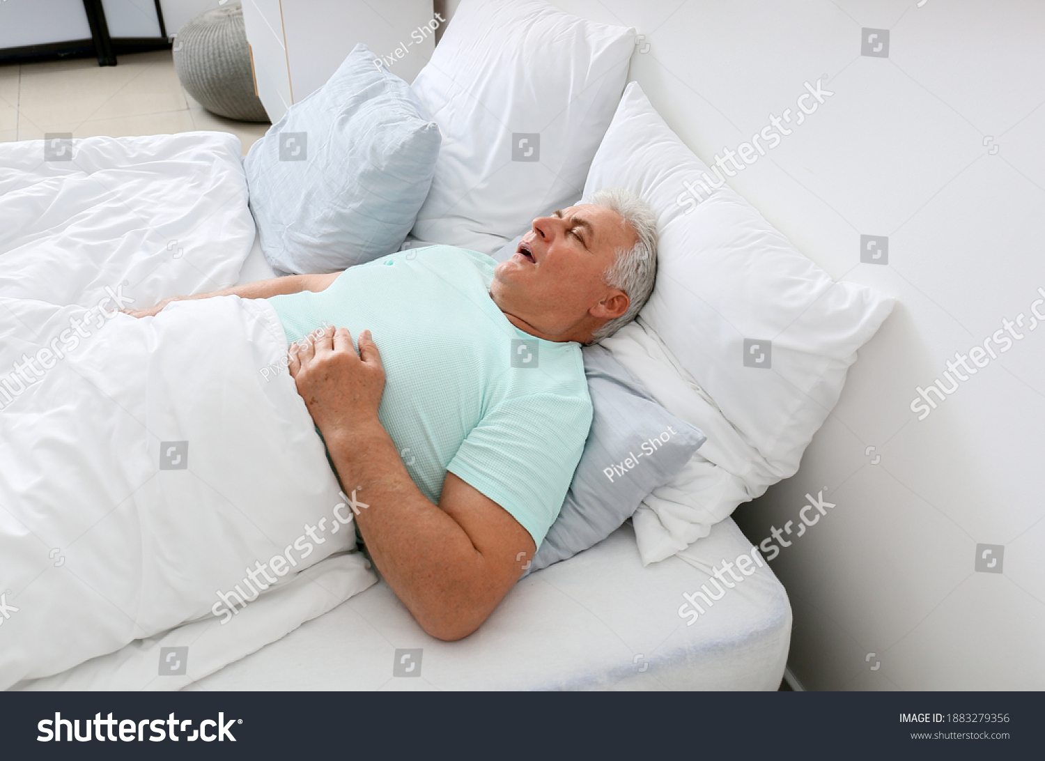 Mature man snoring while sleeping in bed. Apnea problem #1883279356