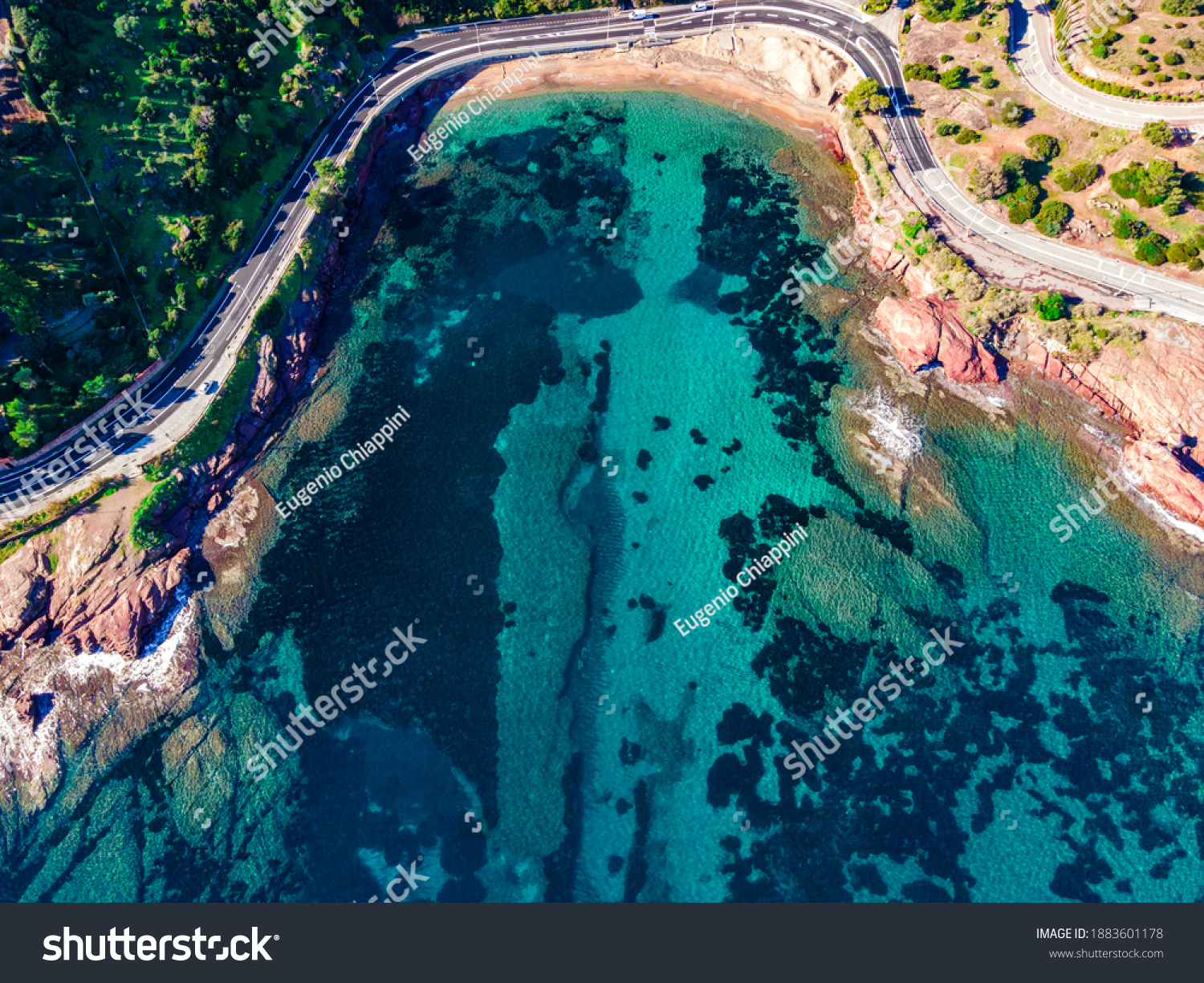 Beach and Coastline French Riviera Côte d'Azur turquoise colour water with red rocks, Roche rouge alongside a road in the village of Agay, close to Cannes #1883601178