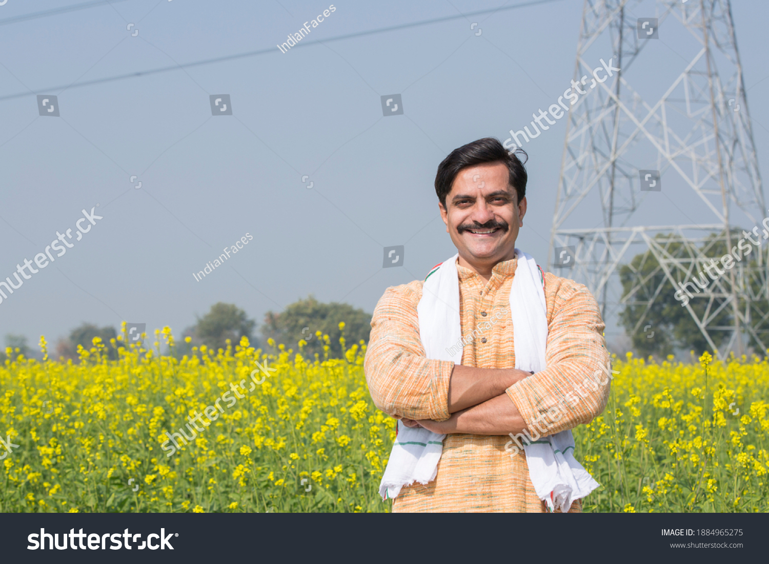 Indian farmer standing in agricultural field #1884965275