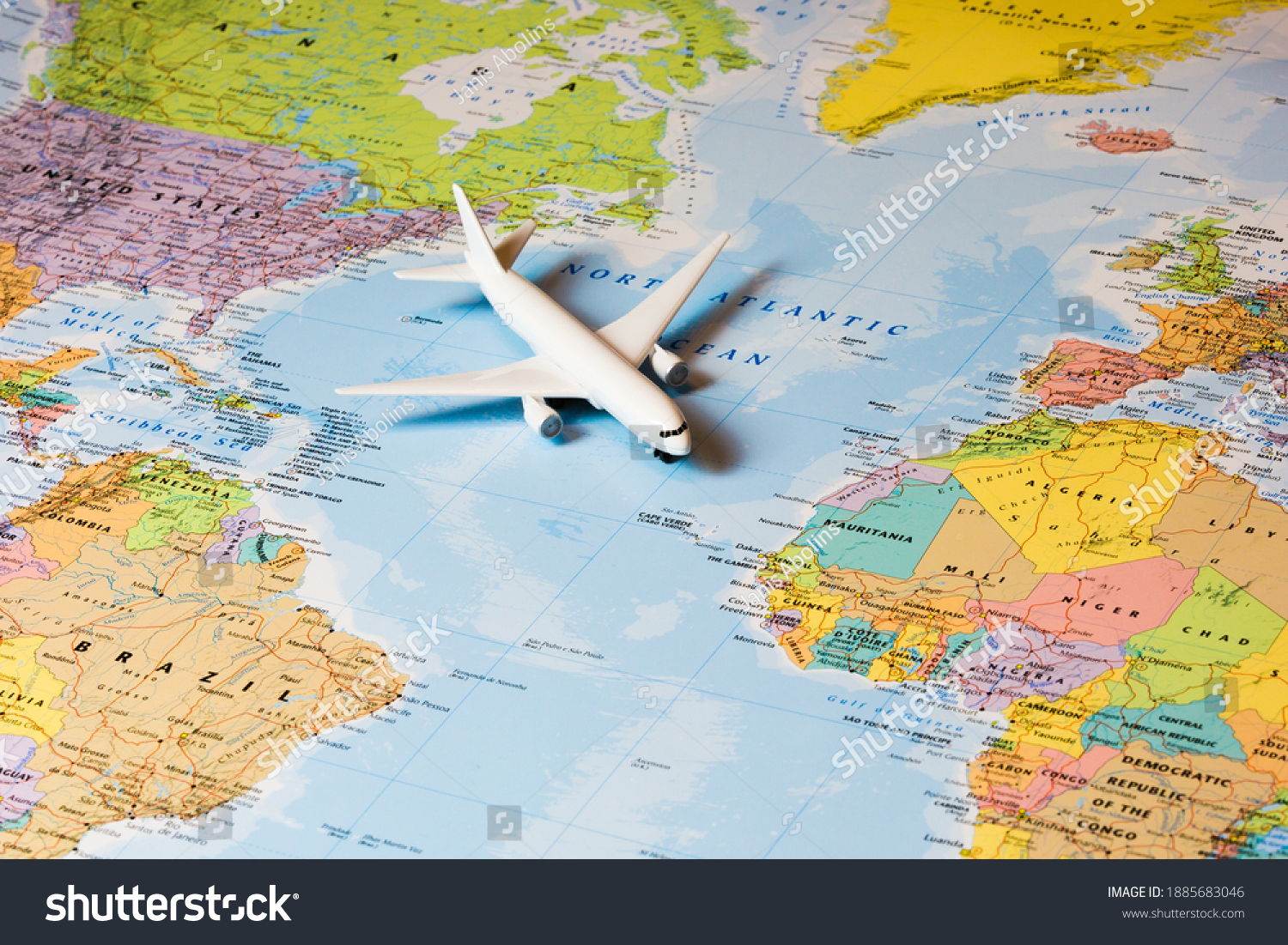 Travel the world. Travelling by plane. Airplane on a world map. #1885683046