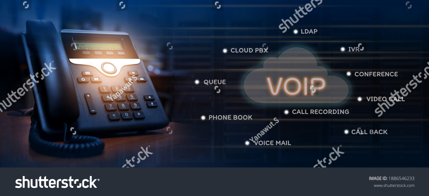VOIP services concept of ip telephone device on work place, blurred data center with server racks, cloud icon with services words of voip #1886546233
