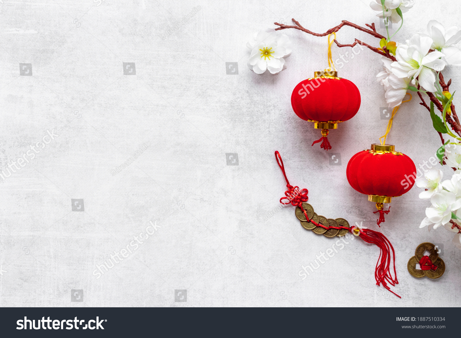 Flat lay of Chinese New Year decoration flowers and red lanterns #1887510334